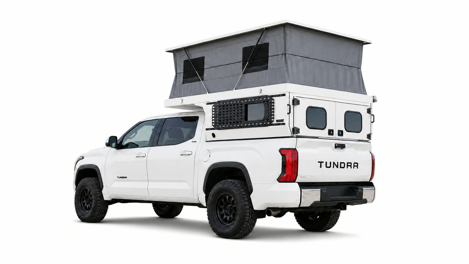 Rear three-quarter view of a white Toyota Tundra carrying an open white Topo Toppers Rincon camper with a tall gray pop-up on a white background.